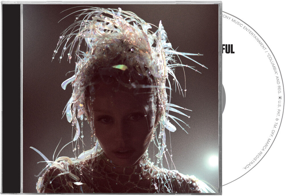 the album cover for Miley Cyrus - Something Beautiful