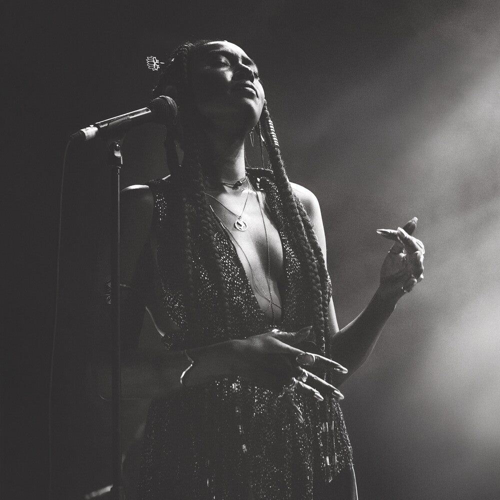 the album cover for Fils-Aime, Dominique - Live at the Montreal International Jazz Festival