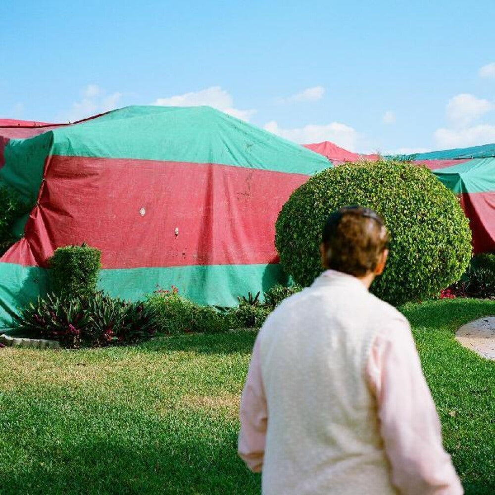 the album cover for Blitzen Trapper - Holy Smokes Future Jokes [Indie Exclusive Limited Edition Red, Blue, Yellow Splatter LP]