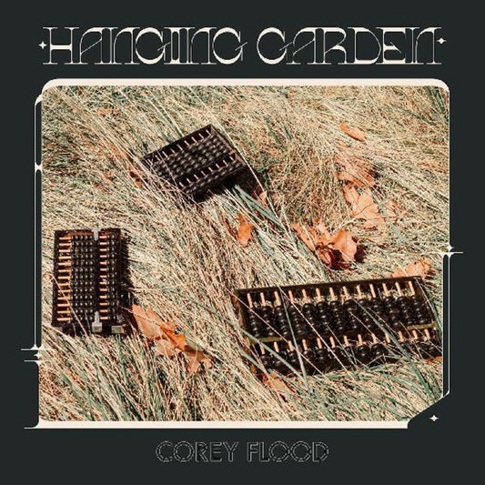 the album cover for Flood, Corey - Hanging Garden [Colored Vinyl] (Pnk) [Indie Exclusive]