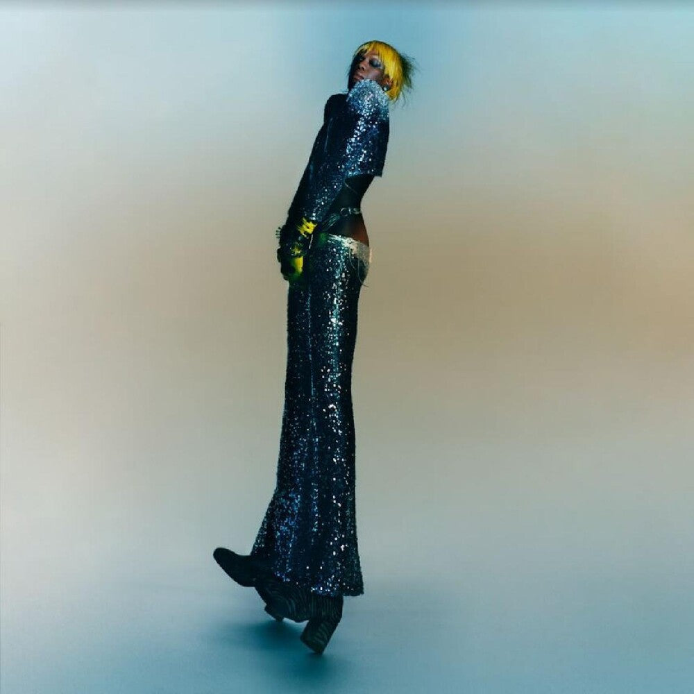 the album cover for Yves Tumor - Praise A Lord Who Chews But Which Does Not Consume; (Or Simply, Hot Between Worlds) [LP]