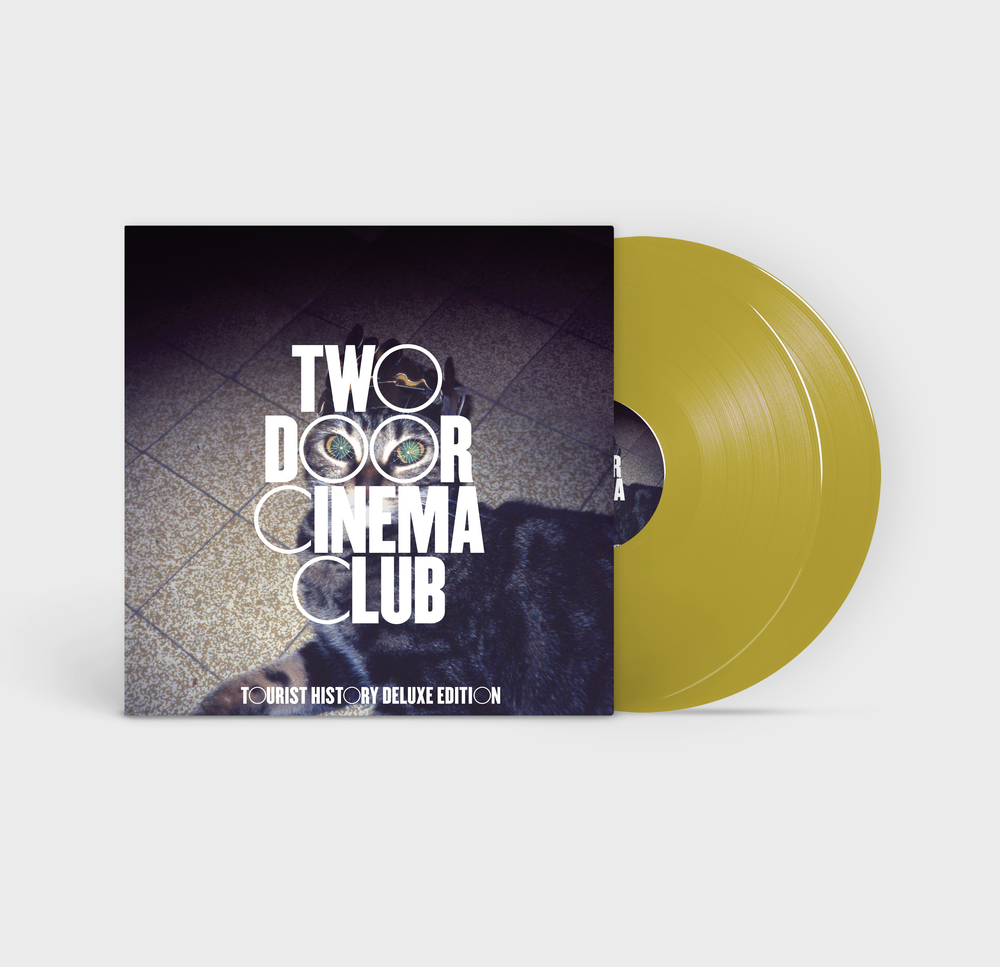 the album cover for Two Door Cinema Club - Tourist History [15th Anniversary Edition RSD Essential Deluxe Gold 2LP]