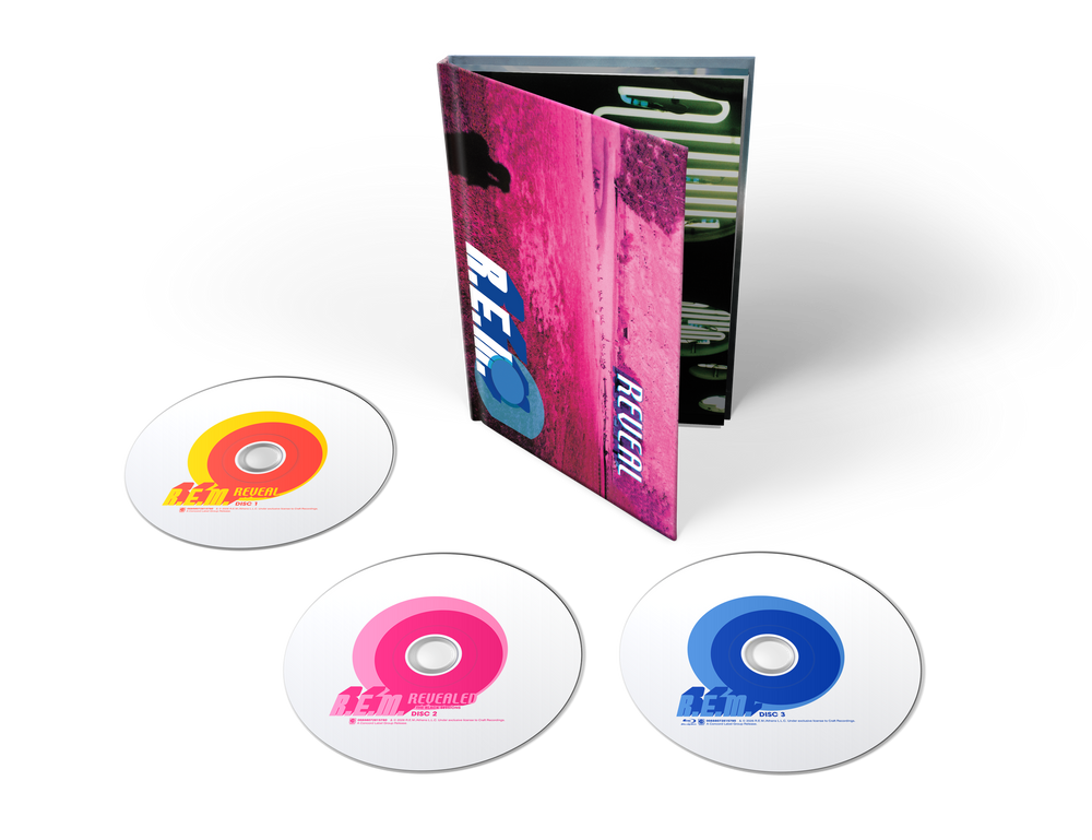 the album cover for R.E.M. - Reveal - 25th Anniversary Edition [2 CD + BR * hardbound book]