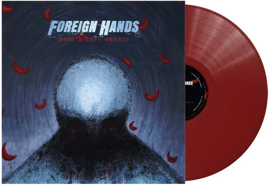 the album cover for Foreign Hands - What's Left Unsaid - Trans Ruby [Colored Vinyl] (Post)