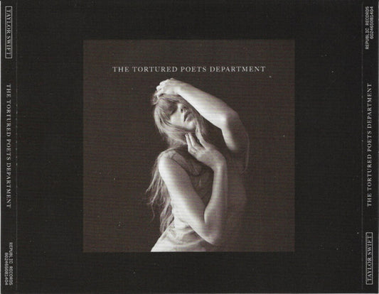 the album cover for Taylor Swift - Tortured Poets Department: The Black Dog [Deluxe]