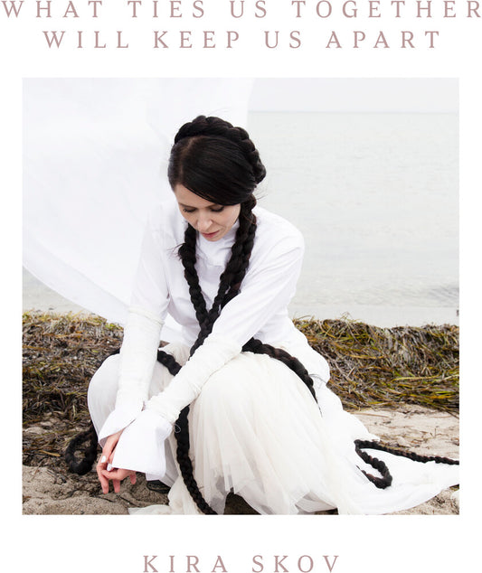 the album cover for Kira Skov - What Ties Us Together, Will Keep Us Apart