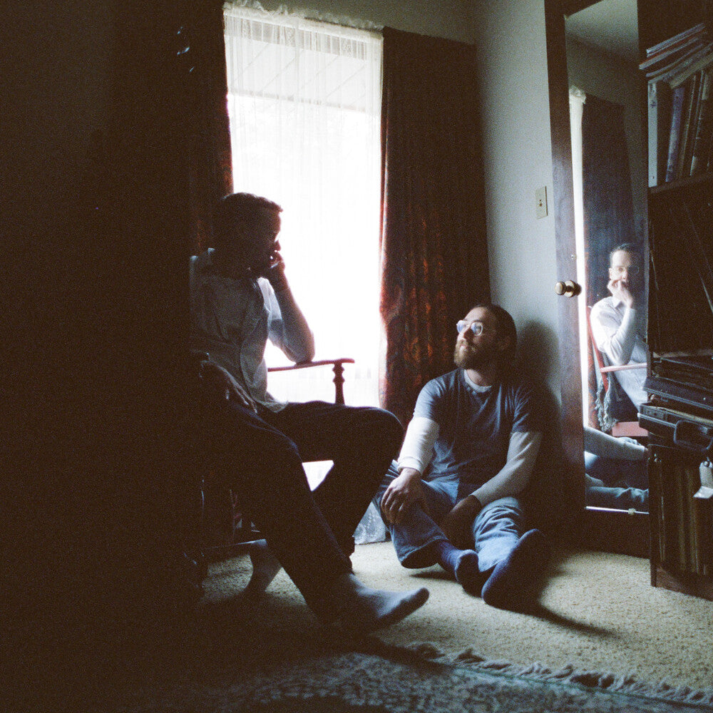 the album cover for Whitney - Small Talk [Indie Exclusive Bone Color LP]