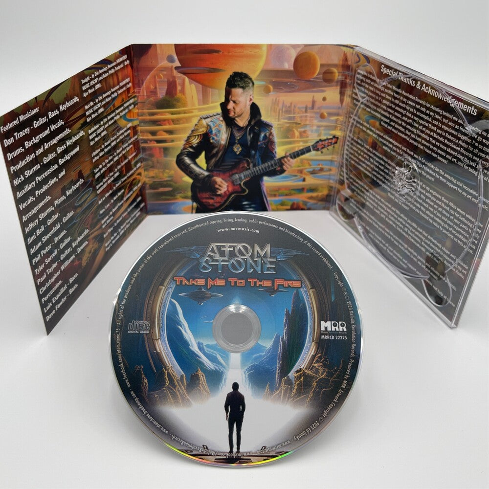 the album cover for Atom Stone - Take Me Two The Fire [Digipak]