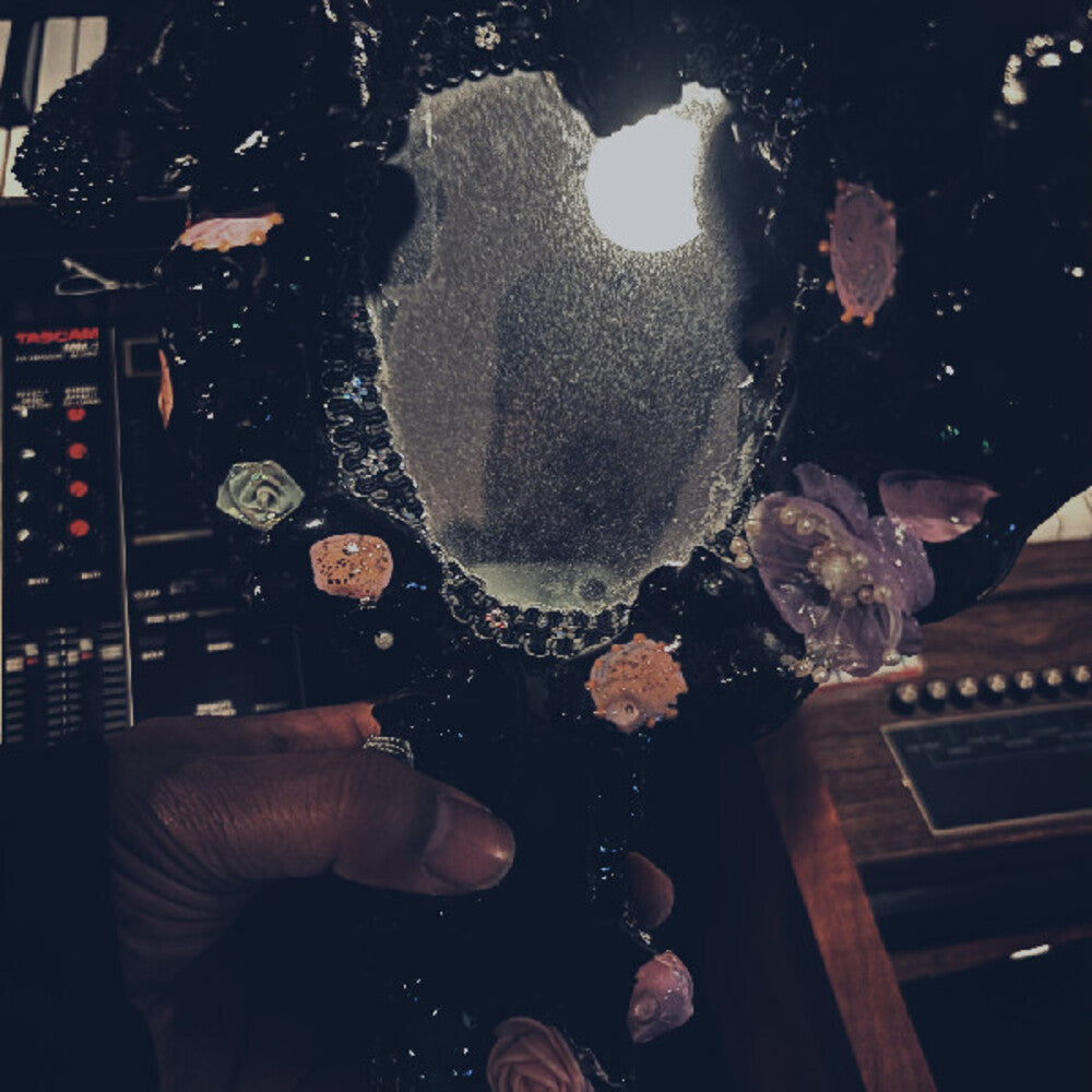 the album cover for Maneka - Bathes And Listens