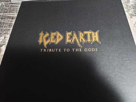 the album cover for Iced Earth - Tribute To The Gods [Colored Vinyl] [Deluxe] (Emb) (Gol) [Limited Edition]